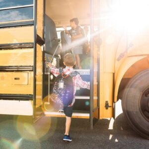Student getting on the bus