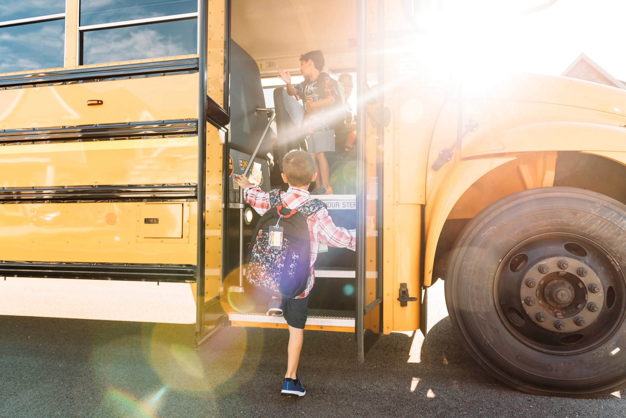 Student getting on the bus